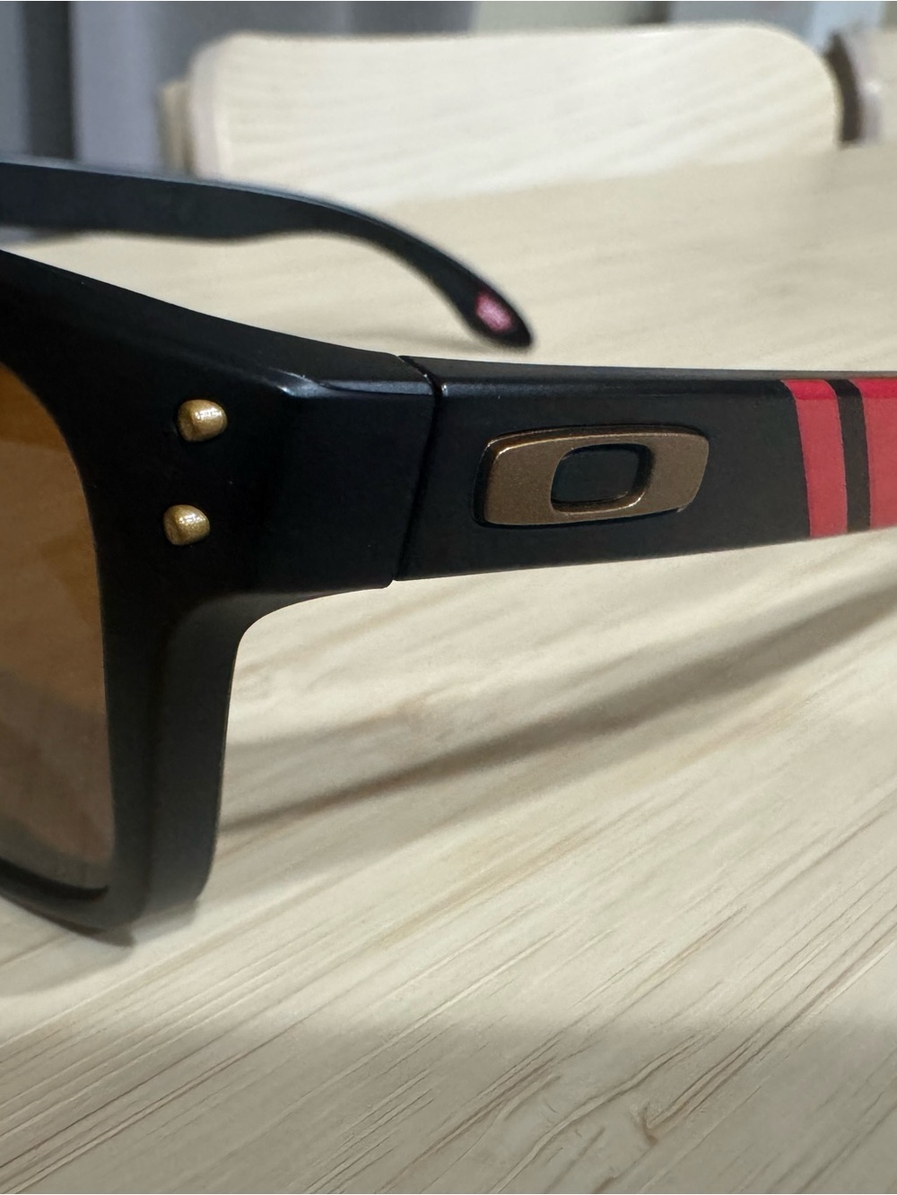 Oakley Black Sunglasses with Red Stripe and Gold Hardware